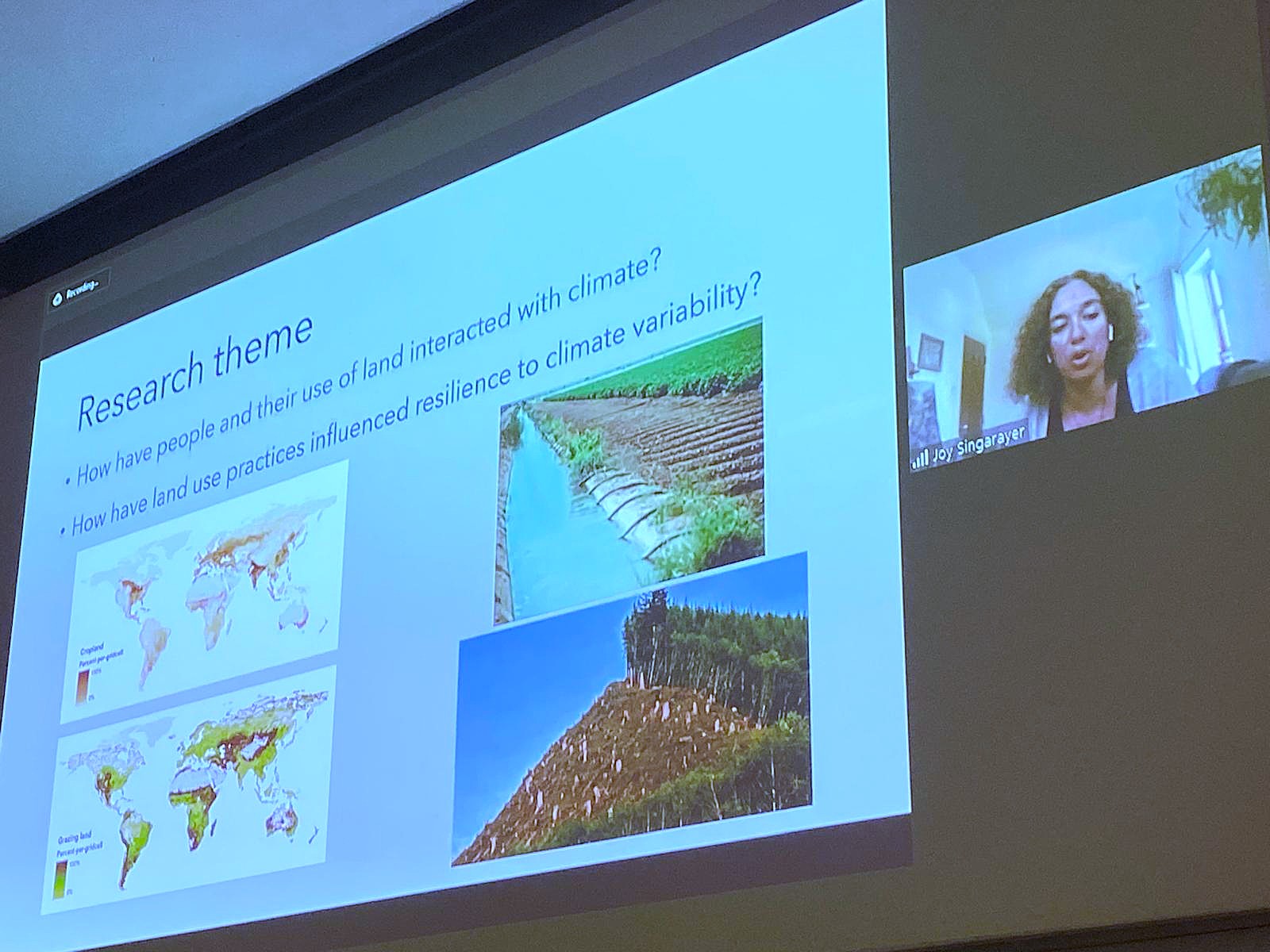 Joy giving a talk at PACS2023