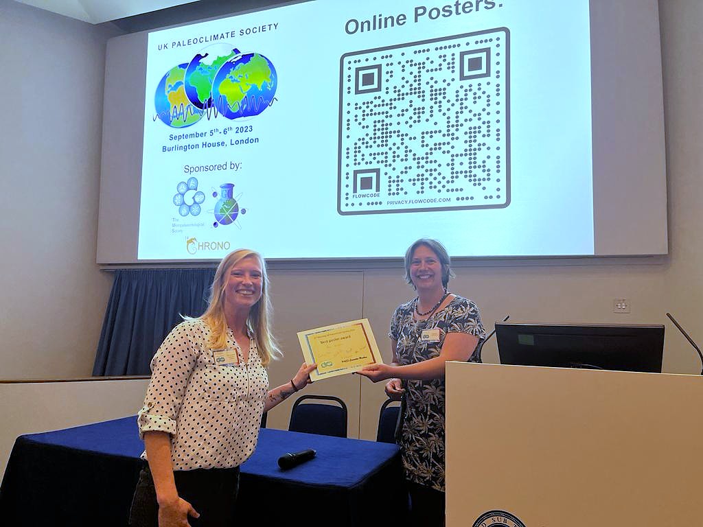 Pam receiving the best poster prize at PACS2023